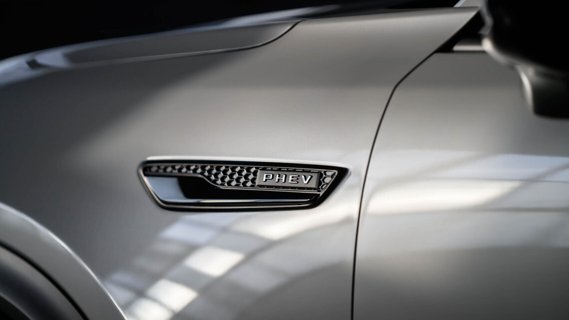 2025 Mazda CX-70 PHEV detail shot of "PHEV" emblem on car