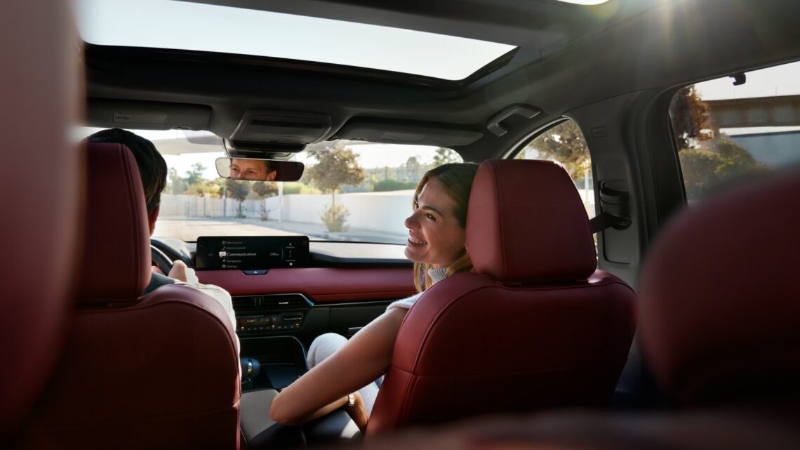 Couple sitting in the front seats of a 2026 Mazda CX-70