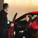 Customer in Mazda car with dealer